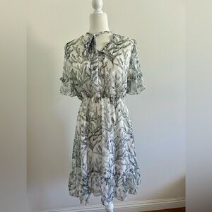 Vintage-Inspired Floral Dress with Tie Neck & Ruffle Sleeves
